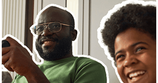 Happy father and child playing video games together